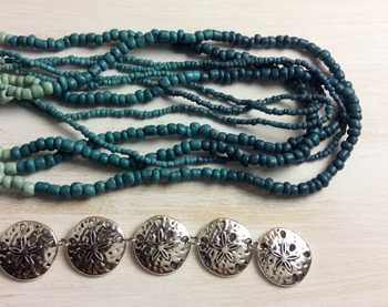Seed beads and silver sand dollars